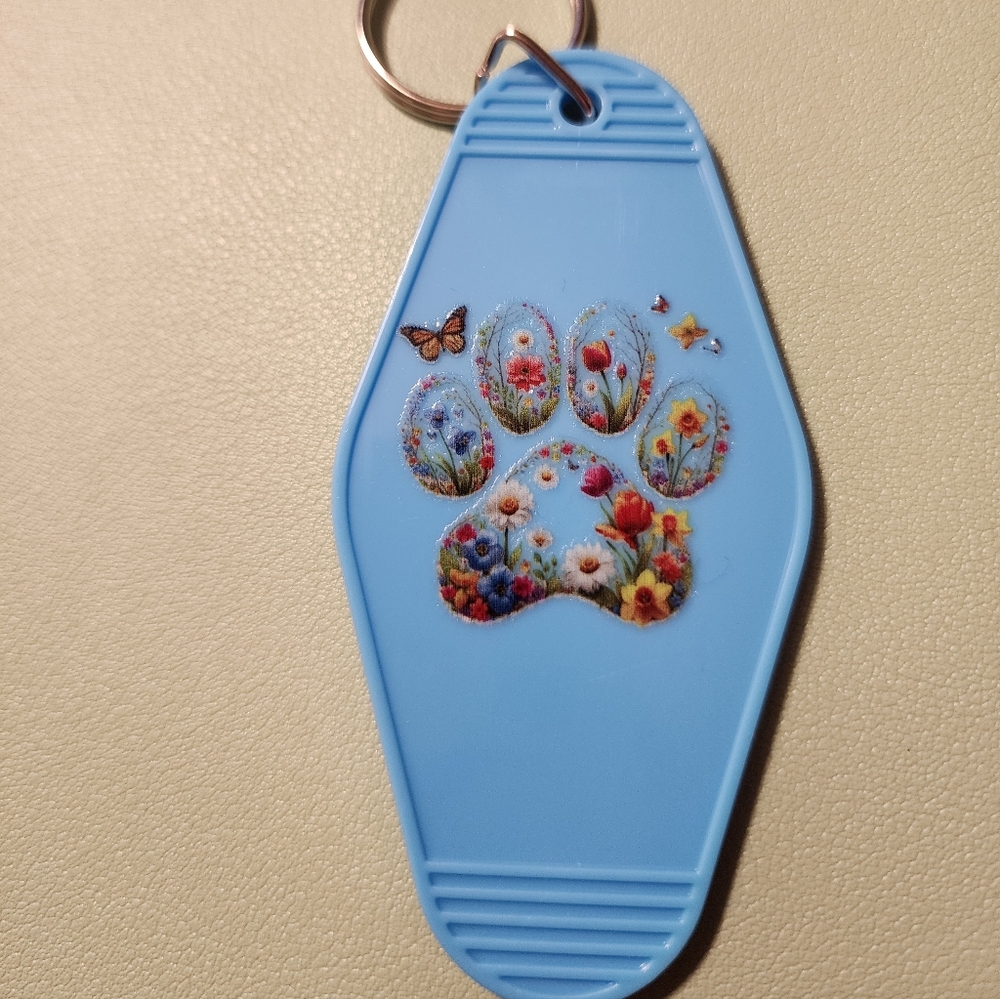 Blue Keychain with Floral Paw Print Design